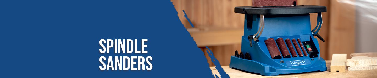 Scheppach spindle sander on a wooden table. In the background, other tools and pieces of wood are visible.