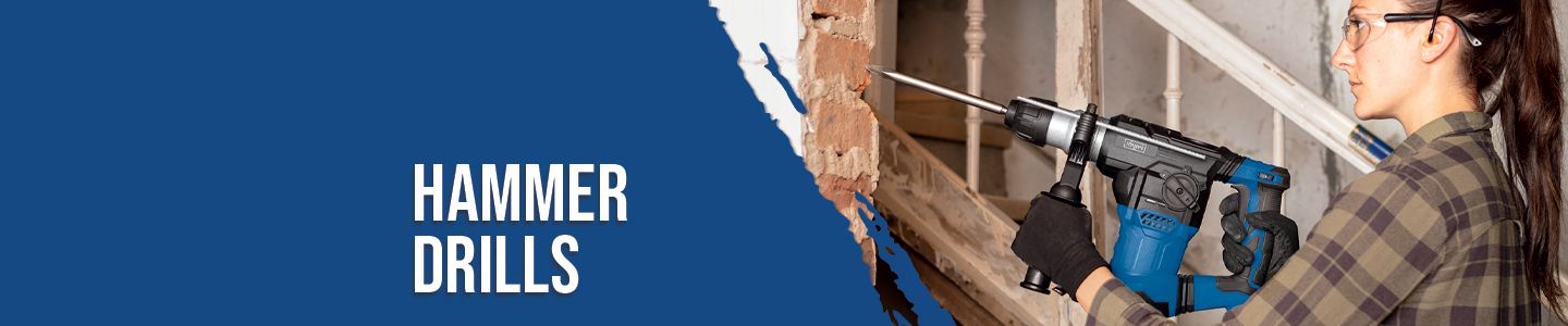 A person is using a Scheppach hammer drill on a wall. The hammer drill has a blue handle and a white body. The person is wearing safety goggles and ear protection.