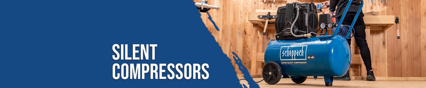 Scheppach silent compressor in a workshop. The compressor is blue and has a 68 dB noise level. The background shows tools and wooden shelves.