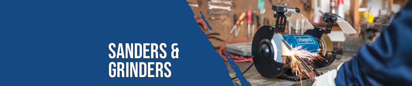 Scheppach sanders and grinders in a workshop. Tools are mounted on the wall, a worker is visible in the background.