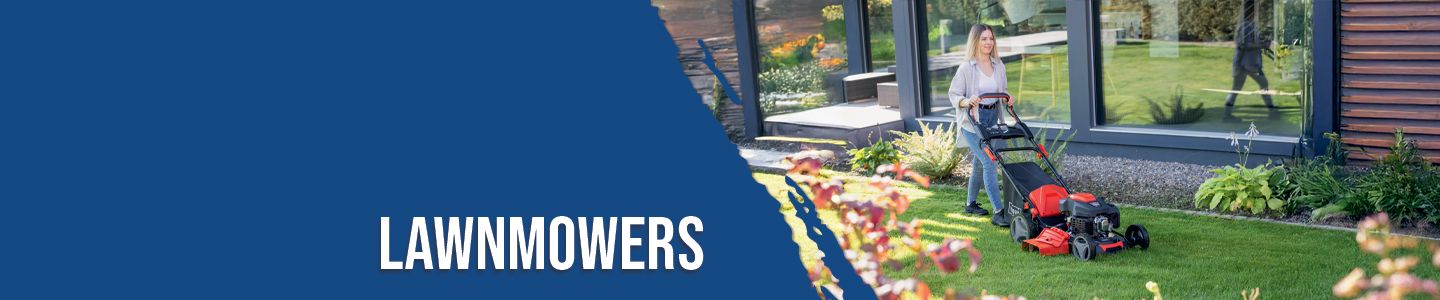 A person is mowing the lawn with a lawnmower in front of a modern house. Flowers and plants are visible in the background.