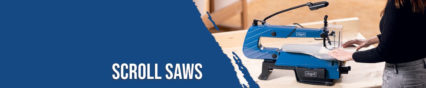 A person is operating a Scheppach scroll saw. The saw is placed on a wooden table and has a lamp for better visibility.