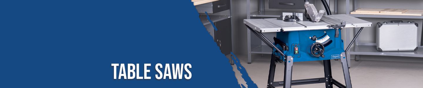 Scheppach table saw with housing and dust box. The saw is mounted on a stand and placed in a workshop.