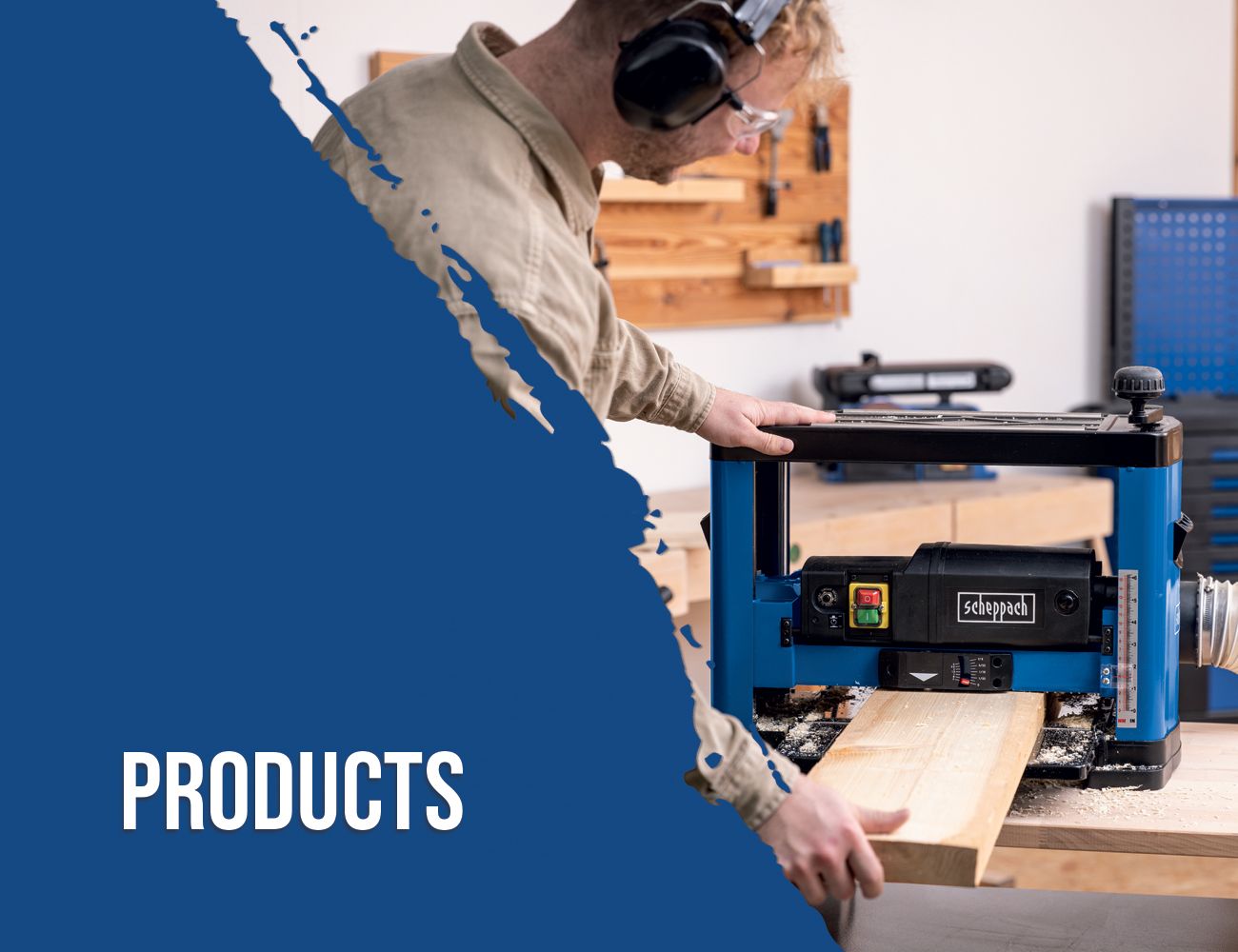 A worker operates a Scheppach handsaw in a workshop. Tools and wooden shelves are visible in the background.