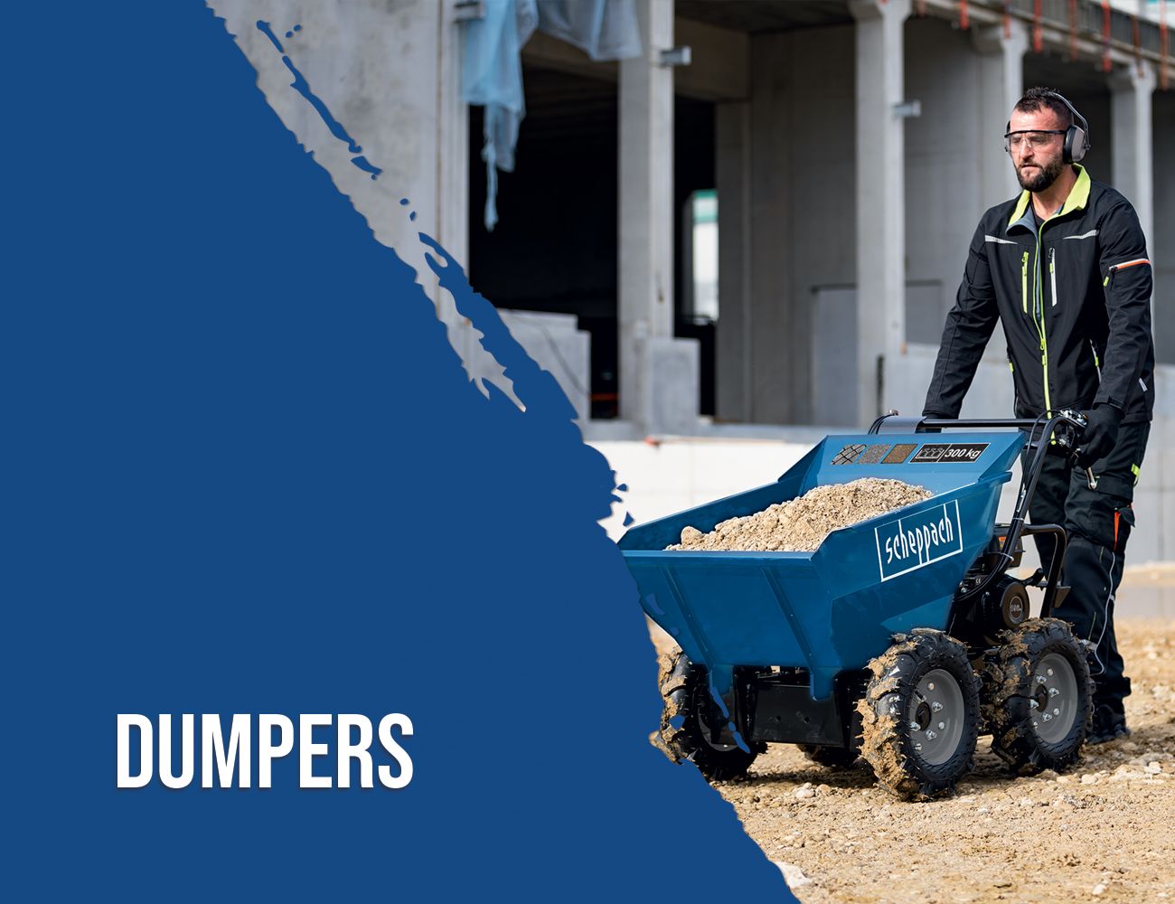 A worker operating a Scheppach mini dumper on a construction site. The dumper is loaded with sand or gravel.