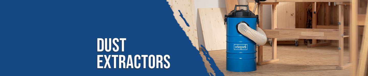 A Scheppach dust extractor in a workshop with wooden shelves and workbenches. The dust extractor has a blue cylinder and a hose connected to a tool.