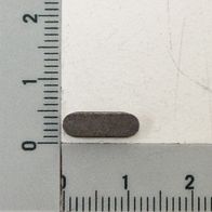 Feather key A4x4x12 next to a ruler for size reference. The feather key is lying horizontally on the ruler.