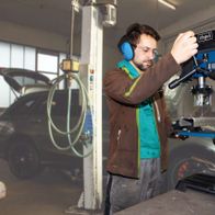 Scheppach bench pillar drill with chuck and workstation attachment in workshop setting