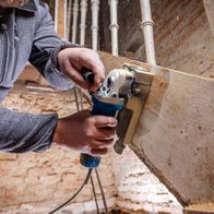 Scheppach paint remover tool in use with interchangeable cutter on material