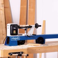 Scheppach wood lathe with workpiece clamp and drive unit, featuring emergency stop