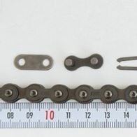 A single roller chain, 26 links 8187, with a closure, by Scheppach. The chain is placed on a ruler and photographed from the front.