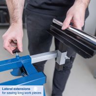 Lateral extensions for sawing long workpieces on the mitre saw base