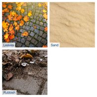 Autumn leaves, sand, and organic debris on a paved surface