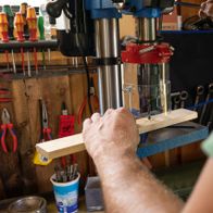 Scheppach bench pillar drill with laser guide, operating on workpiece