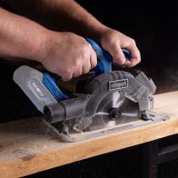 Cordless circular saw with blade, displaying LED feature and maximum cutting depth
