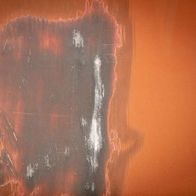 Worn metal brush with visible damage and streaks