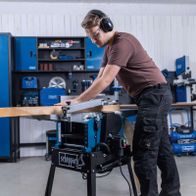 Scheppach HMS1500 planer/thicknesser with mobile base, close-up of woodworking action