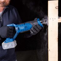 Scheppach cordless reciprocating saw with LED display and battery holder, in use