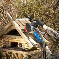 Scheppach nylon wire wheel attachment on tool arm outdoors