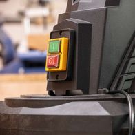 Control panel with green and red buttons for dust extractor operation