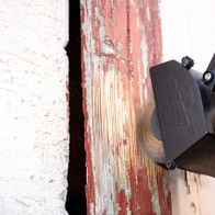 Scheppach tool with brush attachment working on metal surface