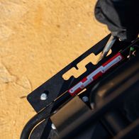 Close-up of a Scheppach dumper component with bolted connection and mounting bracket