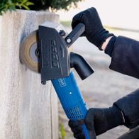 Scheppach brass wire brush with handheld grinding tool in use on surface