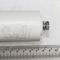 A capacitor labeled 40254003_Skala next to a ruler for size reference. The capacitor is shown from the side.