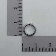 Spring washer by Scheppach, side view, next to a ruler for size reference.