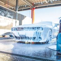 Scheppach pressure washer in use at car wash with vehicle visible