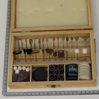 Wooden case containing a 103-piece tool set for a jigsaw with various brushes and attachments