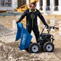 Scheppach dumper with tilt container, AWD, 3 forward/1 reverse gears, shown with tool and terrain