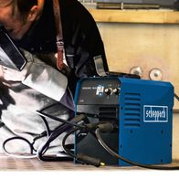 Scheppach multi-purpose welding machine setup with MIG/TIG capabilities, featuring included adapter set