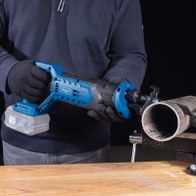 Reciprocating saw with attachment for cutting precision during operation