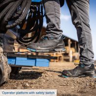 Operator platform with integrated emergency safety switch