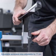 Adjustable workpiece stop for mitre saw stand with 11 cm adjustment range