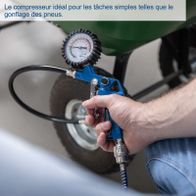 Hand-operated air compressor with gauge for pneumatic tasks