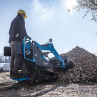 Scheppach skid steer loader with attached bucket, used for material handling and transport operations.