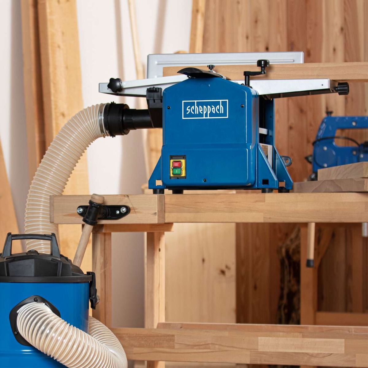 Scheppach planer/thicknesser HMS850 with dust extraction and safety switch visible.