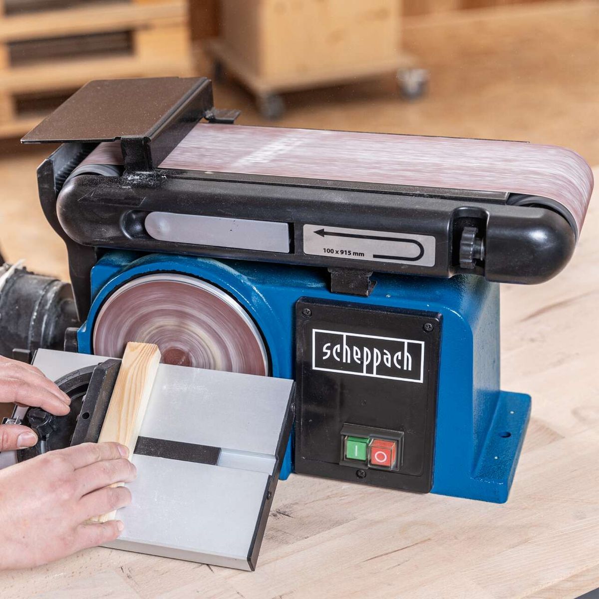 Scheppach belt and disc sander with worktable, showing setup for accurate sanding