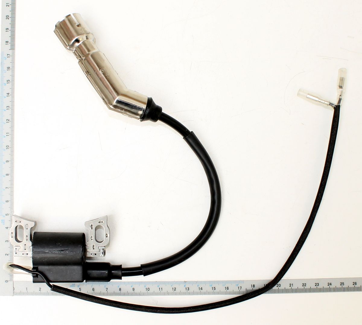 Ignition Coil, top view, with measuring scale for size comparison.