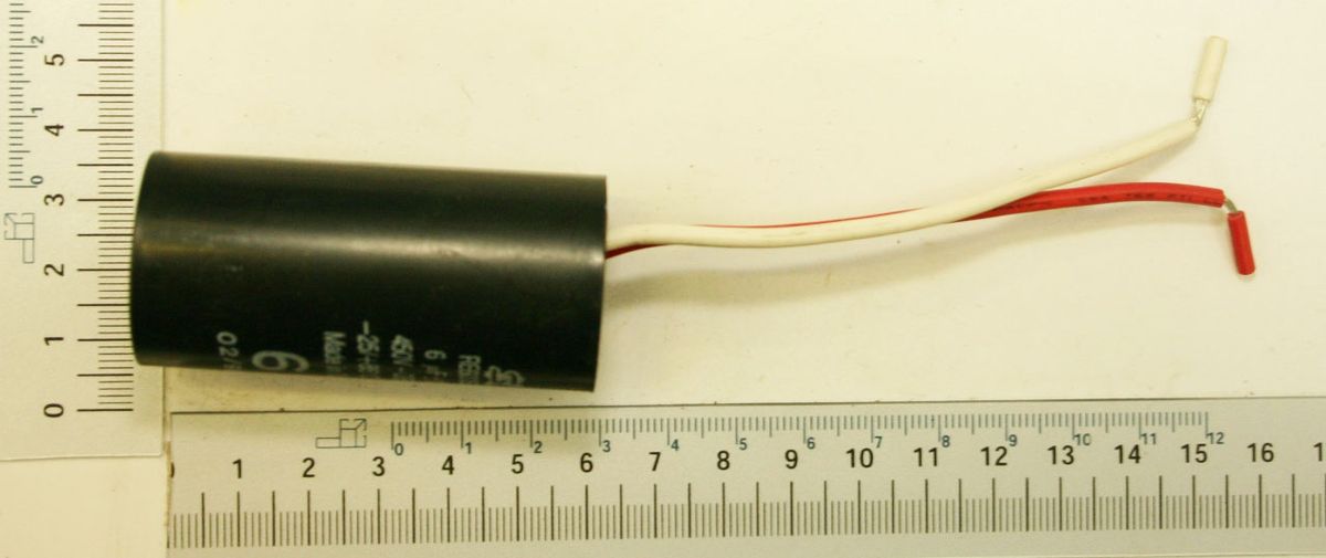 Electrical capacitor with marking and terminal, 6µF / 450V