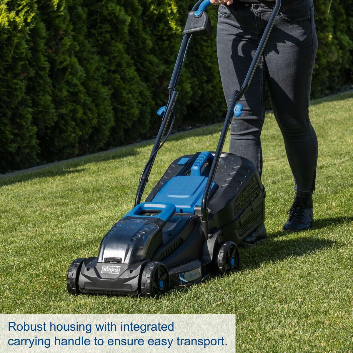 Robust housing with integrated carrying handle for easy transport of a Scheppach battery lawnmower.