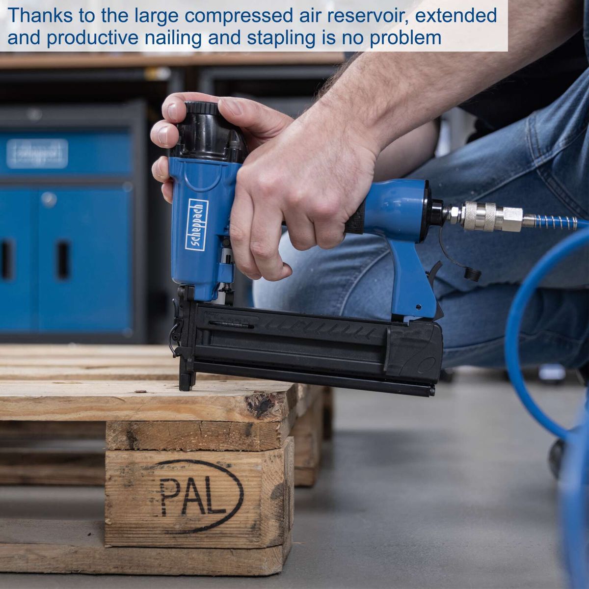 Nail and stapling tool with large compressed air tank for extended operation shown in use