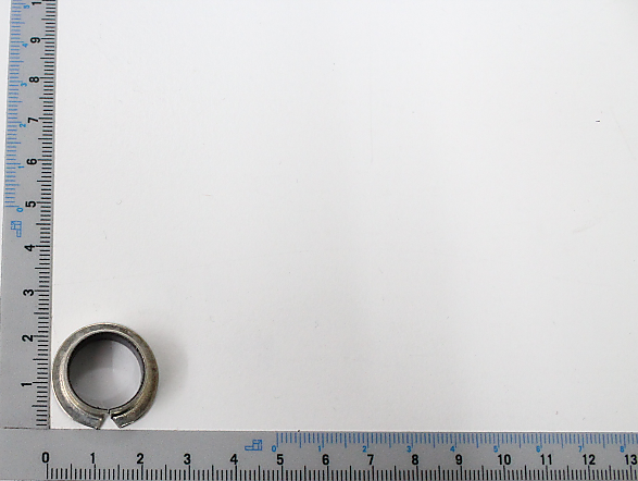 Slide bush Permaglide® PAF 15090 P10 with a ruler in the background. The slide bush is viewed from above.