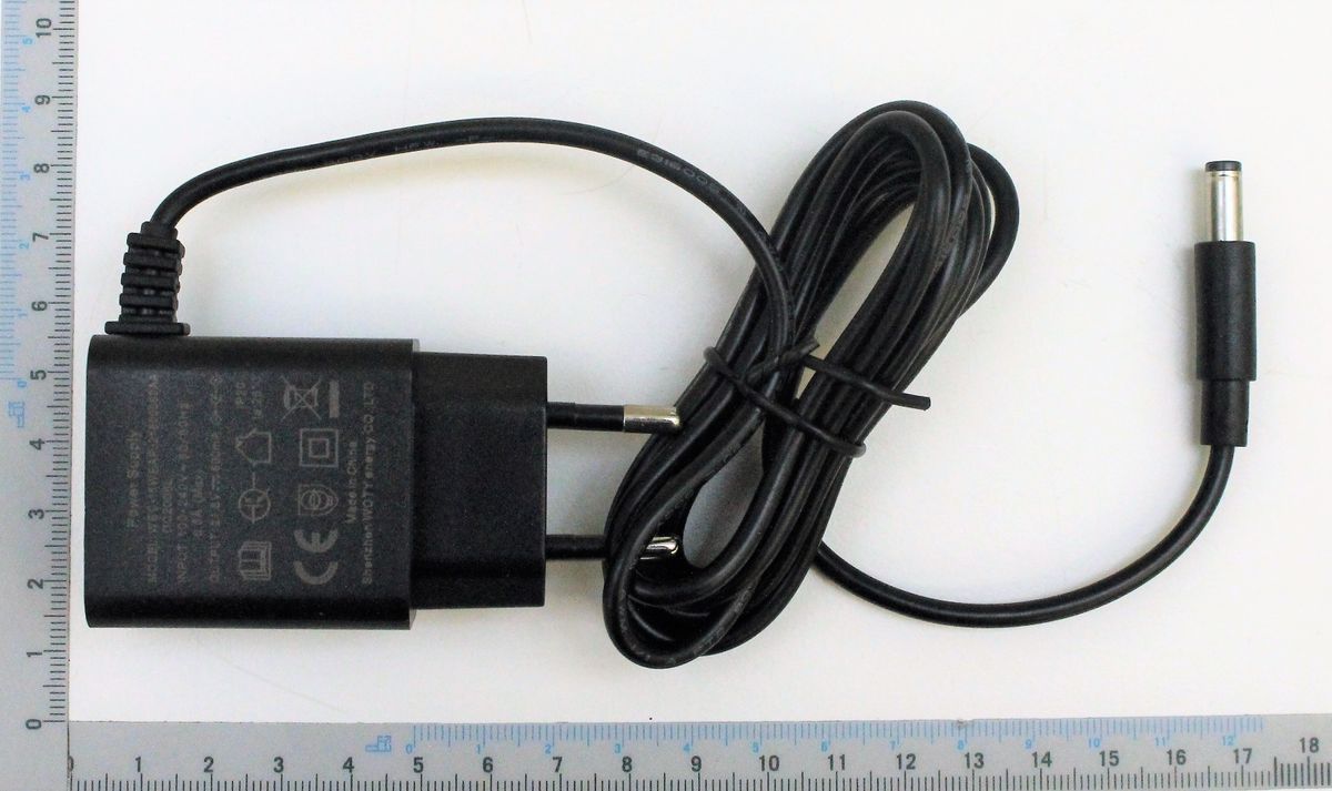 Scheppach battery charger BP2.0A-Li20V. Shown from the side with a ruler for size reference.