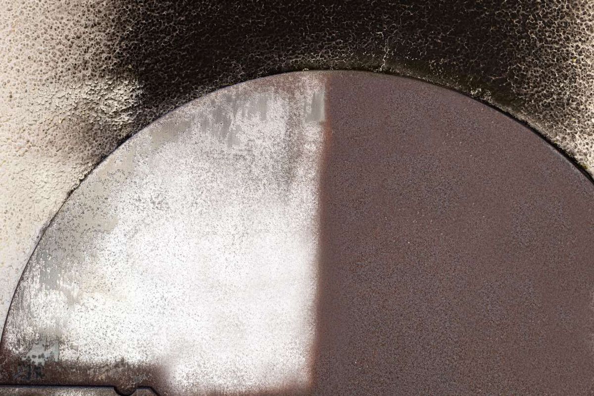 Partial view of a Scheppach satin finishing machine with visible text markings