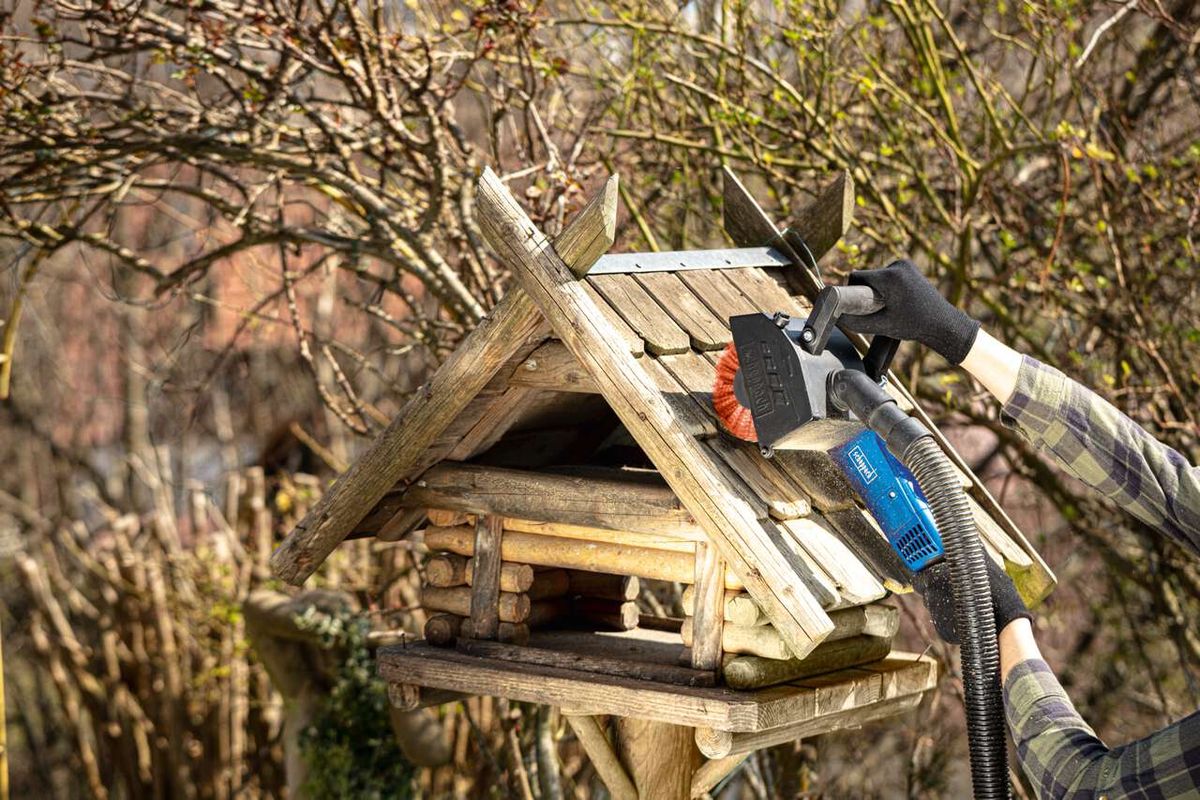 Scheppach nylon wire wheel attachment on tool arm outdoors