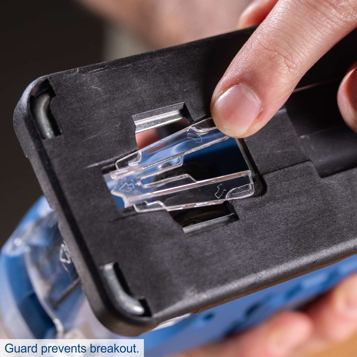 Guard prevents accidental breakout of tool in cordless jigsaw