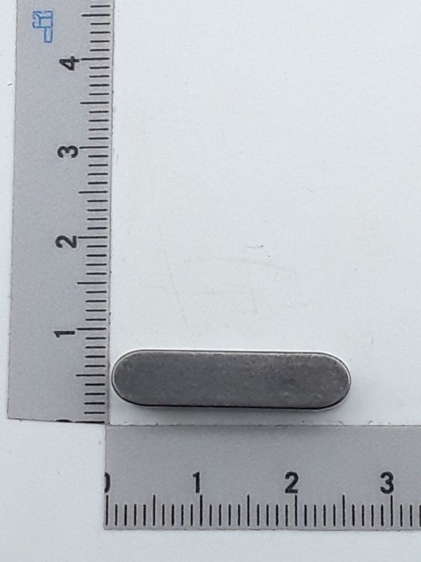 Feather key A6x6x20, shown from the side next to a ruler for size reference.